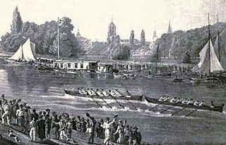 A river scene, with two eight-oared boats racing in the middle of the river, one just in front of the other. There are crowds on each bank and some sailing boats and barges by the far bank. In the distance, trees and church spires.