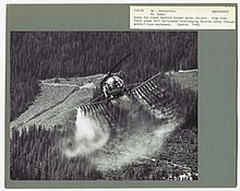 Mexacarbate being sprayed by helicopter. 1968. Sonny Boy Creek Hemlock Looper Spray Project. View from front shows Bell helicopter discharging Zectran spray through aerosol-type equipment. Mt. Baker National Forest, Washington. (32901507325).jpg