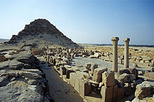 Photograph of the ruins of a corridor and temple