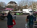 Amsterdam in free photo of the old square Amstelveld with a marketplace of flowers and shopping people; Fons Heijnsbroek, January 2022