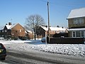 Approaching the junction of a snowy Park House Farm Way and Hordle Road - geograph.org.uk - 1653315.jpg