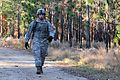 Army Sgt. Jesus Fernandez, a forward observer with 2nd Battalion, 325th Airborne Infantry Regiment, 2nd Brigade Combat Team, 82nd Airborne Division, walks along a trail during the land navigation portion of 121114-A-FO214-388.jpg