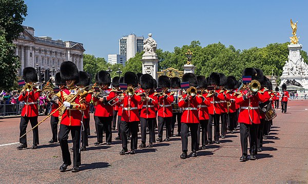 The Band of the Welsh Guards of the British Army play as Grenadier guardsmen march from Buckingham Palace to Wellington Barracks after the Changing Of