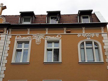 Dormers and stuccoed motifs