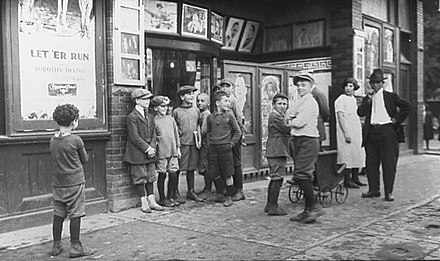 Children in front of a movie theatre, Toronto, 1920s.