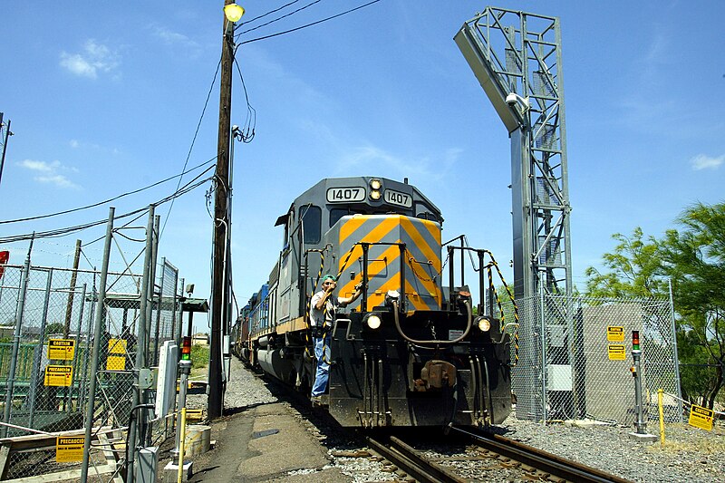 File:CBP Office of Field Operations. “A train is positioned prior to being x-rayed for law enforcement reasons at the US-Mexico barrier by Rail VACIS system”. Gamma Imaging Inspection System 2004.jpg