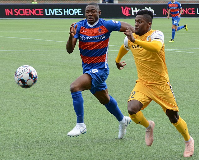 Fanendo Adi (left) was signed in July 2018 as the team's first Designated Player.