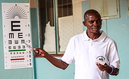 Eye specialist carrying out eye examination on a patient at a district hospital in Zambia Can you see%3F.jpg