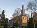 Church with surrounding green area and fence