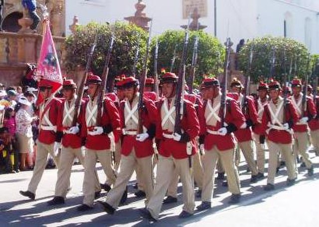 The Colorados of Bolivia in their traditional uniform.