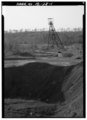 GENERAL VIEW OF PYNE MINE COMPLEX WITH HEADFRAME TO CENTER, LOOKING SOUTHWEST. - Pyne Red Ore Mine, State Route 150, Bessemer, Jefferson County, AL HAER ALA,37-BES.V,9-1.tif