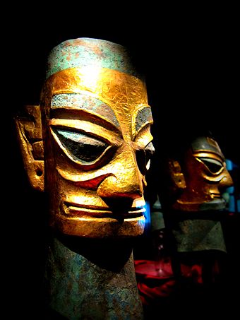 Two bronze heads from Sanxingdui, covered with gold leaf