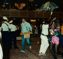 Guy Lillian carrying a box of party supplies at the opening ceremonies of Nolacon II, 1988 Guy H. Lillian III.png