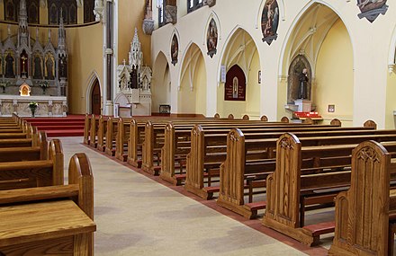 Traditional solid oak church pews with kneelers