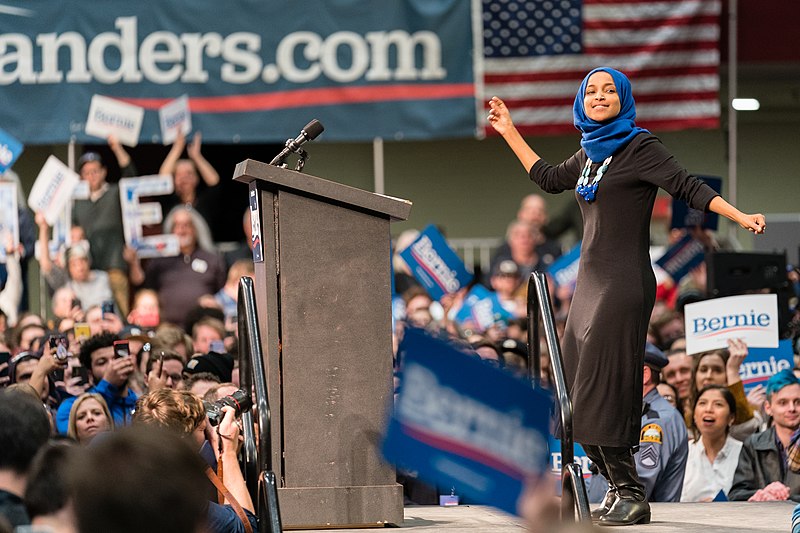 File:Ilhan Omar dances on stage at a Bernie Sanders rally in St Paul, Minnesota (49612442062).jpg