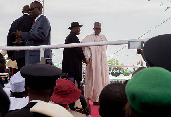 Outgoing President Jonathan in handshake with newly sworn in President Muhammadu Buhari at Eagle Square in Abuja, Nigeria, on 29 May 2015