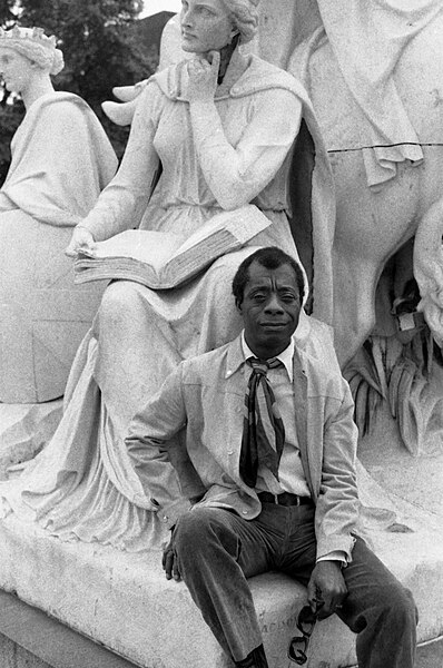 Novelist James Baldwin on the Albert Memorial, Kensington Gardens, London