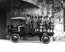 U.S. Marines riding in a Jeffery Quad, Fort Santo Domingo, c. 1916 Jeffery Quad truck with U.S. Marines.jpg