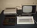 Running workplace for the Robotron KC 85/1, with cassette deck Geracord 6020 Portable, dot matrix printer Robotron K 6313 and Russian Junost-402B television set.