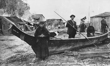 A Chatenossa family poses with a canoe near Cimacum Creek, Nanaimo, Zian, ca. 1914