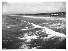 Waves at Long Beach and the Bixby Hotel under construction, c. 1906 Long Beach from across the surf, showing the Hotel Bixby under construction in the distance at right, ca.1906 (CHS-2803).jpg