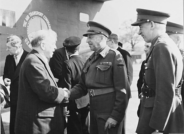 After arriving in England for the forthcoming Imperial conference, William Lyon Mackenzie King, Prime Minister of Canada, is greeted by Crerar and Lie