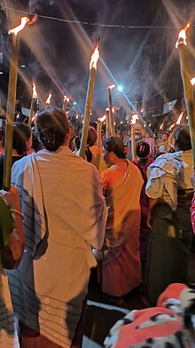 Meira Paibis of Manipur prepare to take out a night march. Meira Paibi.jpg