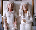 Meryre, a Scribe, and his wife (hieroglyph on his pants, w/ his name)