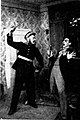 Mișu Fotino (tatăl și fiul) în rolurile Jupân Dumitrache și Rică Venturiano din spectacolul O noapte furtunoasă de I.L. Caragiale la Teatrul de Stat din Brașov, 1950