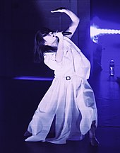 Mitski performing in 2022, incorporating Butoh inspired theatrical choreography into her performance.