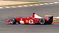 Michael Schumacher driving the Scuderia Ferrari F2002 at the 2002 French Grand Prix, showing sponsorship from Vodafone, Shell, and the white space replacing Marlboro at North American and most European races.