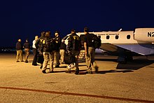 Members of the NTSB's Go Team for the investigation boarding an FAA plane to travel to Miami. NTSB investigates Miami bridge collapse IMG 0009 (39942593765).jpg