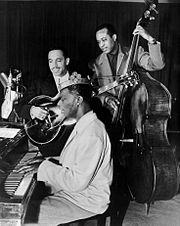 King Cole Trio Time on NBC with Cole on piano, Oscar Moore on guitar, and Johnny Miller on double bass, 1947 Nat King Cole Oscar Moore Johnny Miller King Cole Trio 1947.JPG