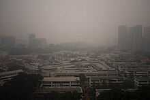 The 2015 Southeast Asian haze led to a Pollutant Standards Index of 353 in Tiong Bahru. PSI 353 over Tiong Bahru -Singapore (21494797589).jpg