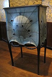 Rococo influences – Commode, by Paul Iribarne Garay (c. 1912), mahogany and tulip wood frame, slate top, green-tinted shagreen upholstery, ebony knobs, base and garlands, Museum of Decorative Arts, Paris