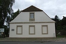 School Museum in Reckahn, Brandenburg an der Havel quoting Mark 10:14 at the entrance. Founded by Friedrich Eberhard von Rochow in 1773, Reckahn was the first one-room school with two age-related classes in Prussia. Schulmuseum Reckahn 085.jpg