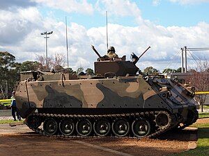 Colour photo of a tracked military vehicle