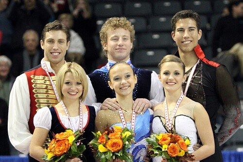 Iliushechkina and Maisuradze on the podium at 2010 Skate Canada