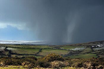 English: A snow shower approaching on Dartmoor...