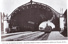 The station in 1886, a few years after the opening with a train leaving for Fossato di Vico. Stazione di Arezzo 1866.png