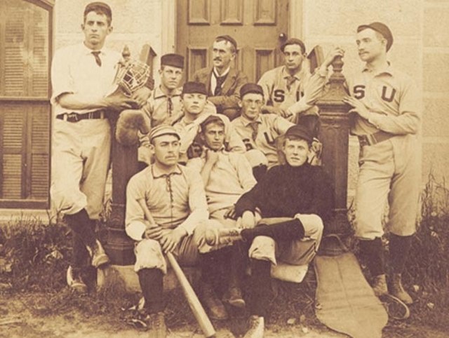 Stephen Crane (front row, center) sits with baseball teammates on the steps of the Hall of Languages, Syracuse University, 1891. (Photo courtesy of th