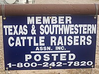 The standard Texas and Southwestern Cattle Raisers Association identification sign; photo taken near the ranch of Gene S. Walker, Sr., in Webb County, Texas. TX and SW Cattle Raisers Assn. sign IMG 6070.JPG