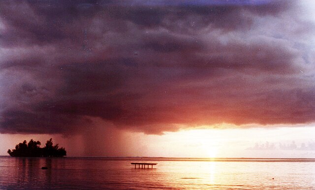 A Tahitian motu off the island of Raiatea at sunset