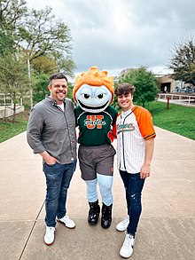 From left to right: Aaron Aryanpur (The Alumni who drew the first drawing of "Temoc"), Temoc (The Mascot of UT Dallas), and Eric Aaberg (Mascot Captain, UT Dallas). Photo was taken at The University of Texas at Dallas.