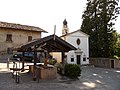 View of the square, with the church and wash house