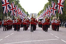 Life Guards with reverse arms leading the coffin in a procession from Buckingham Palace to Westminster Hall for the lying-in-state UK Armed Forces convey The Queen's coffin to Westminster Hall for lying-in-state.jpg