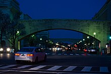 Standing on 15th Street NW, looking east at night along Independence Avenue SW USDA Bridges at Independence Avenue SW - Washington DC.jpg