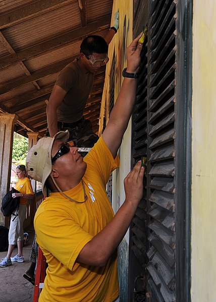 File:US Navy 100311-N-6676S-070 Engineman Fireman Roberto Martinez, from San Diego, cleans shutters at St. Theresa's Early Childhood Development Centre.jpg