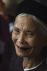 An old Kinh lady with blackened teeth (nhuộm răng đen).