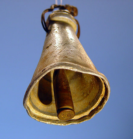 An improvised cowbell, used for sheep or goats. The bell was found in 1988 in a field near Tuqu' (Tekoa) in the West Bank. The bell's body is made of aluminum, probably a broken kitchen utensil, while the clapper is a brass cartridge case (SMI 25 NATO, probably 7.62×51mm).